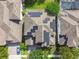 Aerial view of a home with solar panels, showcasing its energy efficiency at 811 Sherbourne Cir, Lake Mary, FL 32746