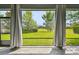 Lush backyard view through screened patio, offering a serene and private outdoor experience at 811 Sherbourne Cir, Lake Mary, FL 32746