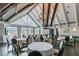 Bright banquet room with vaulted ceilings, large windows, and elegant chandelier, perfect for events at 811 Sherbourne Cir, Lake Mary, FL 32746