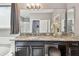 Bathroom featuring granite countertop vanity with a sink, dark wood cabinets, and decorative mirror at 811 Sherbourne Cir, Lake Mary, FL 32746