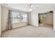 Spacious bedroom with a ceiling fan, neutral carpet, and connecting door to another room at 811 Sherbourne Cir, Lake Mary, FL 32746