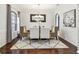 Elegant dining room with dark wood floor, decorative rug, chandelier, and seating for six at 811 Sherbourne Cir, Lake Mary, FL 32746