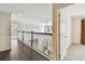 Bright hallway with dark wood floors and white trim, leading to an open area at 811 Sherbourne Cir, Lake Mary, FL 32746