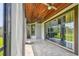 Screened patio with tile flooring and view of landscaped yard, creating a relaxing outdoor space at 811 Sherbourne Cir, Lake Mary, FL 32746