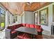 Covered patio with wood ceiling, ceiling fans, and outdoor dining, perfect for entertaining at 811 Sherbourne Cir, Lake Mary, FL 32746
