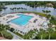 Resort-style swimming pool with lap lanes, lounge chairs, spa, and beautiful lake views, perfect for relaxation and recreation at 811 Sherbourne Cir, Lake Mary, FL 32746