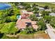 Spacious home featuring mature landscaping and a screened-in pool at 1010 Juliette Blvd, Mount Dora, FL 32757