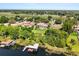 Stunning lakefront home with a private dock and boat house and lush landscaping at 1010 Juliette Blvd, Mount Dora, FL 32757
