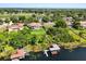 Beautiful waterfront home featuring a private dock, boat lifts and lush surroundings at 1010 Juliette Blvd, Mount Dora, FL 32757