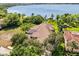 Gorgeous waterfront property with mature trees and views of the serene lake at 1010 Juliette Blvd, Mount Dora, FL 32757
