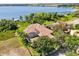 Lovely lakeside home with mature landscaping and a private screened-in lanai at 1010 Juliette Blvd, Mount Dora, FL 32757