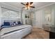 Cozy bedroom with stylish decor, comfortable bed, and ample natural light at 1010 Juliette Blvd, Mount Dora, FL 32757