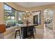 Breakfast nook with counter seating and floor-to-ceiling windows for abundant light and outdoor views at 1010 Juliette Blvd, Mount Dora, FL 32757