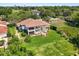 Impressive home with a well-manicured lawn, inviting terraces, and a charming balcony at 1010 Juliette Blvd, Mount Dora, FL 32757