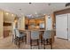 Kitchen with granite counters, stainless appliances, and island with bar seating at 1010 Juliette Blvd, Mount Dora, FL 32757