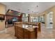Spacious kitchen features a large island with seating, granite counters, and a breakfast bar at 1010 Juliette Blvd, Mount Dora, FL 32757