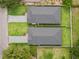 Birds eye view of 2 homes featuring gray roofs, green grass, and brick driveways at 1113 Naples Dr, Orlando, FL 32804