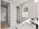 Well-lit bathroom featuring a quartz countertop, a modern sink, and neutral decor at 1113 Naples Dr, Orlando, FL 32804
