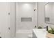 Modern bathroom features white marble tile, matte black hardware, and a sleek vanity at 1113 Naples Dr, Orlando, FL 32804