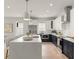 Modern kitchen with a large island, white countertops, navy cabinets, and stainless steel appliances at 1113 Naples Dr, Orlando, FL 32804