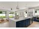 Modern kitchen boasting an island, stainless appliances, and a seamless flow into the living area at 1113 Naples Dr, Orlando, FL 32804
