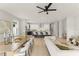 Open concept living area with modern kitchen, dining table and stylish furnishings at 1113 Naples Dr, Orlando, FL 32804