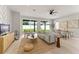 Spacious living room with an open floor plan, backyard access, and modern furnishings at 1113 Naples Dr, Orlando, FL 32804