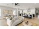 Open-concept living area with dining space flowing into a modern kitchen featuring a center island at 1113 Naples Dr, Orlando, FL 32804
