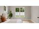 Bright bedroom with light-colored walls, wood flooring, and large windows at 1113 Naples Dr, Orlando, FL 32804
