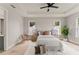 Bright bedroom with tray ceiling, light-colored walls, wood flooring, and dual windows at 1113 Naples Dr, Orlando, FL 32804
