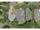 An aerial view shows a private residence featuring a fenced backyard with a screened pool at 11721 Camden Park Dr, Windermere, FL 34786