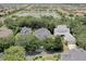 A beautiful aerial view of a lakeside community and a private home with lush landscaping at 11721 Camden Park Dr, Windermere, FL 34786