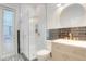 Modern bathroom with a glass-enclosed shower and a sleek vanity with gold hardware at 11721 Camden Park Dr, Windermere, FL 34786