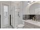 Elegant bathroom with glass-enclosed shower, modern fixtures, and designer tile work at 11721 Camden Park Dr, Windermere, FL 34786