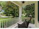 Inviting front porch with a porch swing, perfect for relaxing and enjoying the outdoors at 11721 Camden Park Dr, Windermere, FL 34786