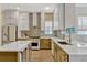 Bright kitchen with stainless steel appliances, custom cabinets, countertops, and island at 11721 Camden Park Dr, Windermere, FL 34786