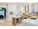 Open kitchen featuring custom cabinets, modern appliances, wine fridge, and gorgeous countertops at 11721 Camden Park Dr, Windermere, FL 34786