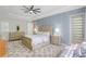 Serene main bedroom with a plush rug, patterned accent wall, and natural light at 11721 Camden Park Dr, Windermere, FL 34786