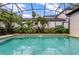 Beautiful backyard oasis with a sparkling pool, lush greenery, and a relaxing atmosphere at 11721 Camden Park Dr, Windermere, FL 34786