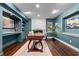Finished basement with a fireplace, white brick wall and wooden desk at 120 Springwood Trl, Altamonte Springs, FL 32714