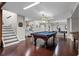 Large basement with pool table, foosball table, and stairs to upper level at 120 Springwood Trl, Altamonte Springs, FL 32714