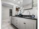 Updated bathroom with double vanity, grey cabinets, modern fixtures, and beautiful marble floors at 120 Springwood Trl, Altamonte Springs, FL 32714