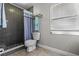 Bathroom featuring a shower with gray subway tile and modern fixtures and white toilet at 120 Springwood Trl, Altamonte Springs, FL 32714