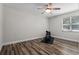 Bedroom space that is ready for customization with hardwood flooring and an exercise bike at 120 Springwood Trl, Altamonte Springs, FL 32714