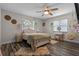 Charming bedroom with ceiling fan, hardwood floors, pendant lighting, and an inviting hammock chair at 120 Springwood Trl, Altamonte Springs, FL 32714