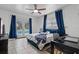 Bedroom featuring a ceiling fan and French doors leading to the pool at 120 Springwood Trl, Altamonte Springs, FL 32714