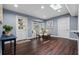 Bright dining area featuring hardwood floors, a skylight, and views to the pool at 120 Springwood Trl, Altamonte Springs, FL 32714