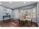Inviting dining area with hardwood floors and bay window with a built-in bench at 120 Springwood Trl, Altamonte Springs, FL 32714