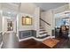 Open entryway with hardwood floors, staircase, and decorative molding at 120 Springwood Trl, Altamonte Springs, FL 32714