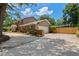 Exterior view showing the home's brick accents, garage, and driveway at 120 Springwood Trl, Altamonte Springs, FL 32714